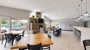 Eagan apartment for rent - A modern dining room with a wooden table and chairs.