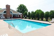 Eagan apartment for rent - a swimming pool with a building in the background
