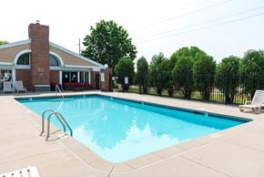 Eagan apartment for rent - a swimming pool with a building in the background