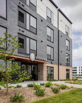 Rosemount apartment for rent - A modern building with the word "COOPER" on the entrance.