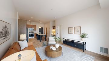 Rosemount apartment for rent - A living room with a brown couch and a coffee table.