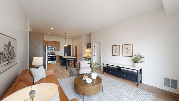 Rosemount apartment for rent - A living room with a brown couch and a coffee table.