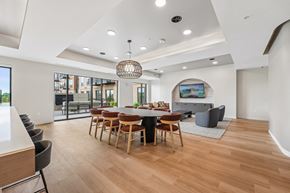 Rosemount apartment for rent - A modern dining room with a wooden table and chairs.