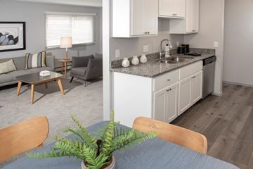 Chaska apartment for rent - a kitchen and living room with a table and chairs