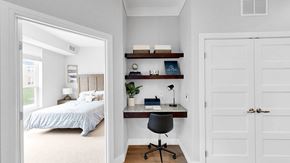 Lakeville apartment for rent - A bedroom with a bed, desk, and chair.