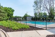 Inver Grove Heights apartment for rent - a swimming pool with a black fence in front of it