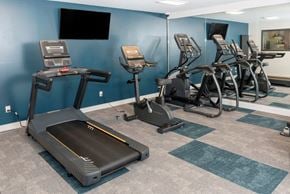 Inver Grove Heights apartment for rent - a room filled with lots of exercise equipment