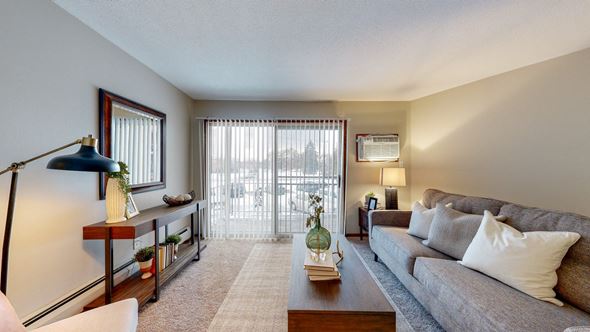 New Brighton apartment for rent - a living room with a couch and a coffee table