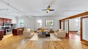 Minneapolis apartment for rent - A living room with a brown sofa and a coffee table.