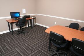 Lakeville apartment for rent - a conference room with two desks and a computer