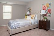 Lakeville apartment for rent - a bedroom with a bed and a dresser