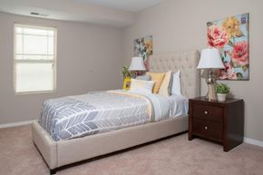 Lakeville apartment for rent - a bedroom with a bed and a dresser