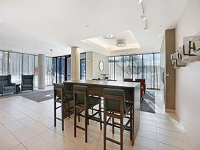 Minneapolis apartment for rent - A modern dining room with a bar stool style table and chairs.at Third North Apartments, Minnesota, 55401
