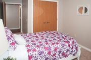 New Hope apartment for rent - a bedroom with a bed and a wooden door