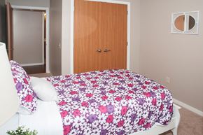 New Hope apartment for rent - a bedroom with a bed and a wooden door