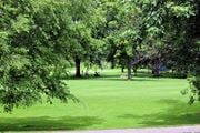 New Hope apartment for rent - A golf course with a green lawn and trees.