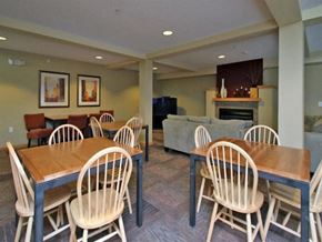St. Paul apartment for rent - Dining Room with a Wooden Table at Joseph's Pointe at Upper Landing Apartments, St. Paul, Minnesota
