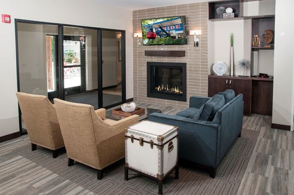 Saint Paul apartment for rent - a living room with a couch and chairs and a fireplace