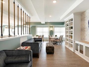 White Bear Lake apartment for rent - A living room with a grey couch and a wooden coffee table.