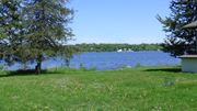 Medicine Lake apartment for rent - a view of the lake from the yard of a house