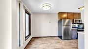 New Hope apartment for rent - A kitchen with a refrigerator, microwave, and oven.