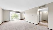 New Hope apartment for rent - A spacious room with a carpeted floor and a sliding glass door leading to a balcony.