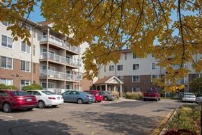 Saint Paul apartment for rent - Osceola Place exterior of community with pretty fall colors on trees