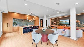 Victoria apartment for rent - A modern dining room with a round table and chairs.