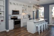 Shoreview apartment for rent - Kitchen With White Cabinetry And Appliances at The McMillan, Minnesota, 55126