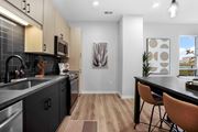 Vadnais Heights apartment for rent - an open kitchen and dining room with a table and chairs