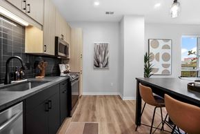 Vadnais Heights apartment for rent - an open kitchen and dining room with a table and chairs