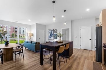 Vadnais Heights apartment for rent - a living room and dining room with a table and chairs