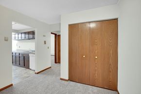 Bloomington apartment for rent - a bedroom with a wardrobe and a bathroom with a sink