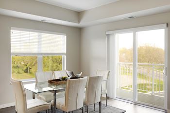 A dining room with large windows