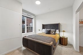 Minneapolis apartment for rent - A bedroom with a large bed and a window.