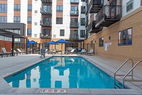 New Brighton apartment for rent - Pool With Relaxing Chairs at The Exchange Apartments, New Brighton, MN