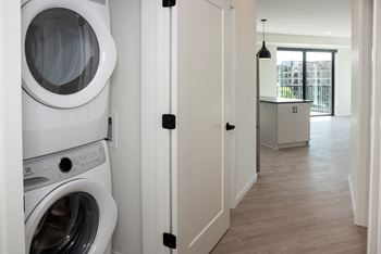 Laundry center with machines next to folding counter