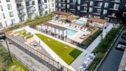 St. Paul apartment for rent - an aerial view of an apartment complex with a pool and grassy area at The Mason, Minnesota, 55114