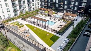 St. Paul apartment for rent - an aerial view of an apartment complex with a pool and grassy area at The Mason, Minnesota, 55114