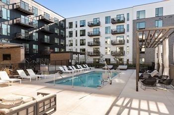 Poolside sundeck with relaxing chairs