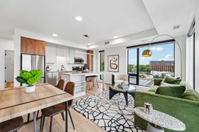 St. Paul apartment for rent - A modern kitchen with a dining table and chairs.