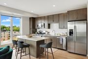 Minneapolis apartment for rent - a kitchen with a large island and stainless steel appliances at The Mezz at West Lake Quarter, Minneapolis, 55416