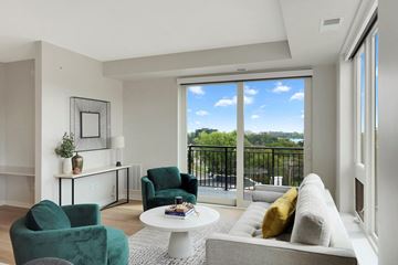 Minneapolis apartment for rent - a living room with a couch and chairs and a balcony