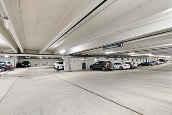 A parking garage with cars in it