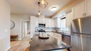 Rosemount apartment for rent - a kitchen with white cabinets and stainless steel appliances at The Morrison, Rosemount, 55068