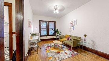 Minneapolis apartment for rent - a living room with a couch and a table and a window
