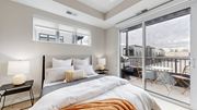 Long Lake apartment for rent - a bedroom with a bed and a sliding glass door to a balcony