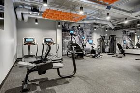 South St. Paul apartment for rent - a gym with treadmills and other exercise equipment in a building