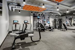South St. Paul apartment for rent - a spacious workout room with treadmills and other exercise equipment