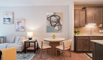 South St. Paul apartment for rent - a living room and kitchen with a table and chairs